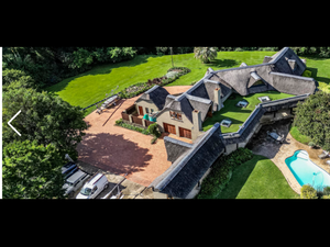 Thatched farm home on the river 