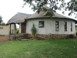 Thatch Roof Home on Large Stand with Borehole