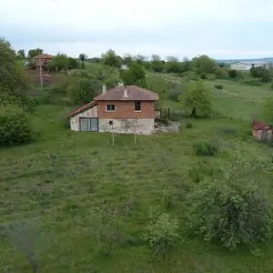 house with big land close to the sea 