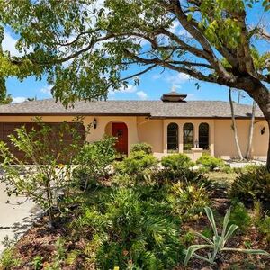 This charming 3-bedroom, 2-bath home sits on a rare corner d