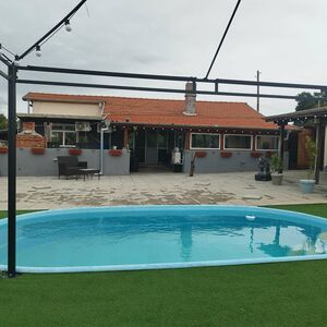 Two renovated houses with pool and large yard for sale near 