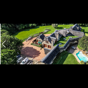 Thatched farm home on the river 