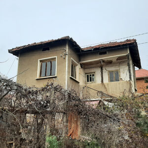 An old house with plot of land & quiet location in village